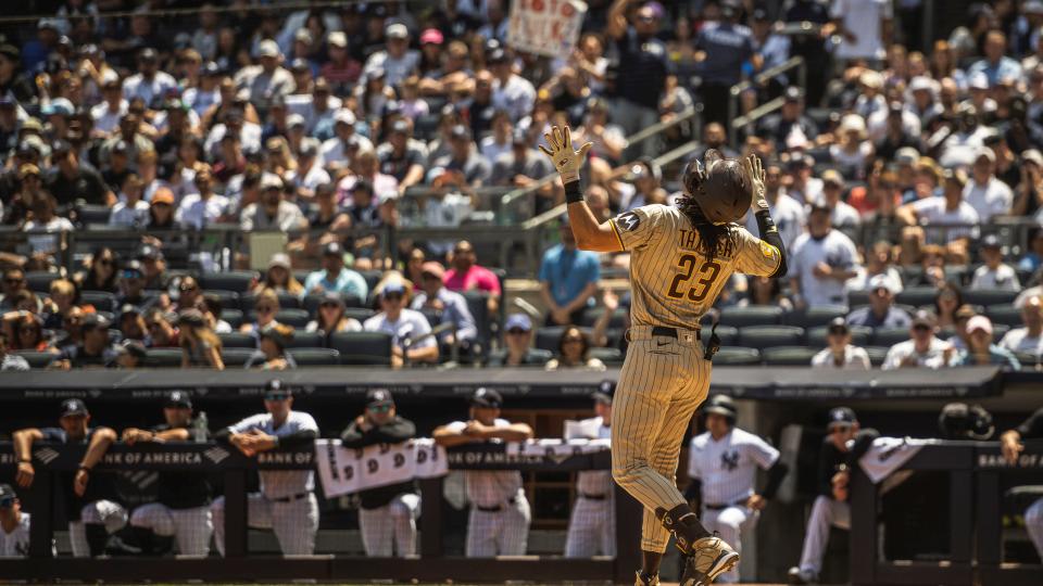 a baseball player celebrating after hitting a home run in New York