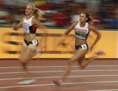Brianne Theisen-Eaton of Canada (L) and Jessica Ennis-Hill of Britain compete in the 200 metres heats of the women's heptathlon during the 15th IAAF World Championships at the National Stadium in Beijing, China August 22, 2015. REUTERS/Phil Noble