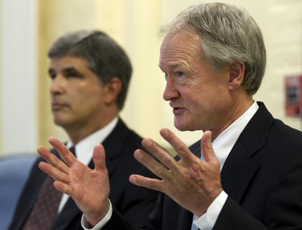 Rhode Island Gov. Lincoln Chafee, right, faces reporters following a closed-door session of the state's Economic Development Corp. board Wednesday, May 16, 2012, in Providence, R.I., as EDC legal counsel David Gilden looks on at left. Former Red Sox pitcher Curt Schilling is asking Rhode Island for additional help to save his video game company, prompting state leaders to consider whether the firm is viable enough to justify the investment. (AP Photo/Steven Senne)