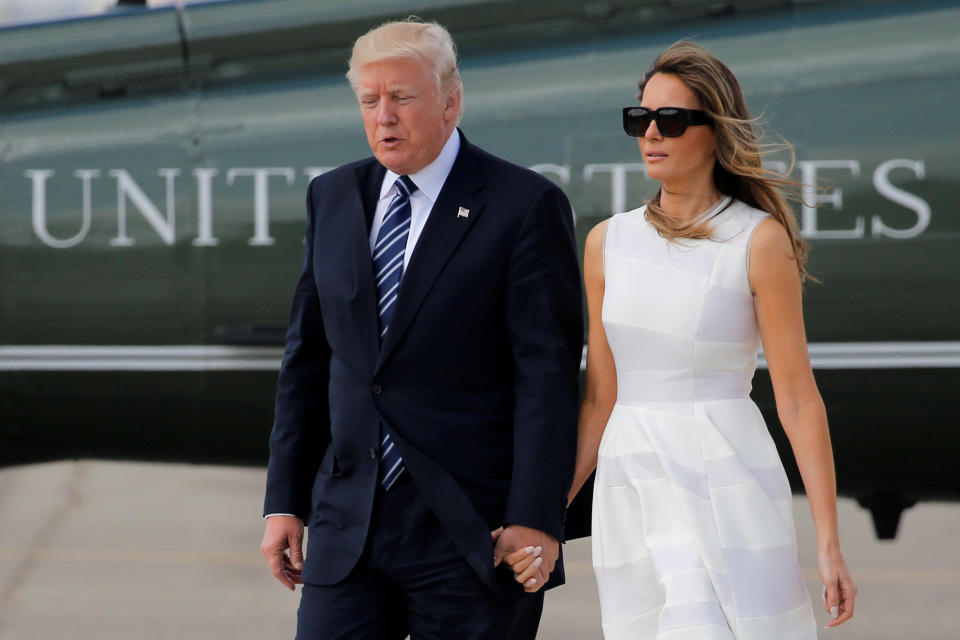 U.S. President Donald Trump and first lady Melania Trump hold hands as they arrive to board Air Force One for travel to Rome from Ben Gurion International Airport in Tel Aviv, Israel on May 23.&nbsp;