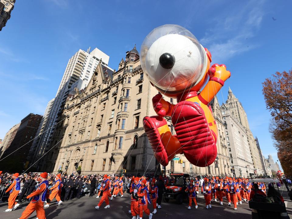 The Snoopy balloon floats above the parade.