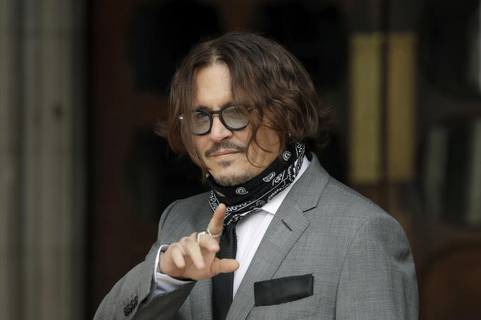 American actor Johnny Depp turns round and poses for the media as he arrives at the High Court in London, Monday, July 13, 2020. Depp is expected to wrap up his evidence at his libel trial against a tabloid newspaper that accused him of abusing ex-wife Amber Heard. The Hollywood star is suing News Group Newspapers, publisher of The Sun, and the paper’s executive editor, Dan Wootton, over an April 2018 article that called him a “wife-beater.” (AP Photo/Matt Dunham)