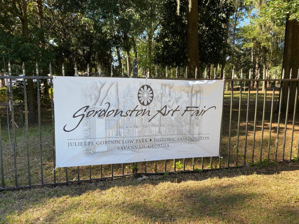 A sign advertising Gordonston Art Fair adorns the fences surrounding Juliette Low Park.