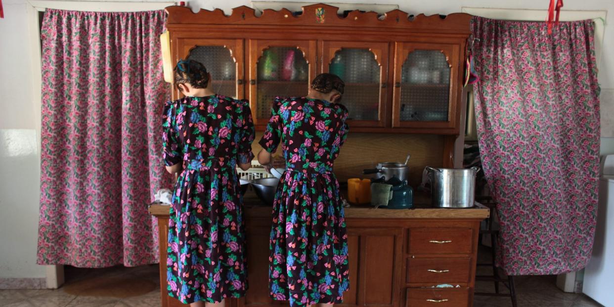 Mennonite teenagers performing their daily chores at home