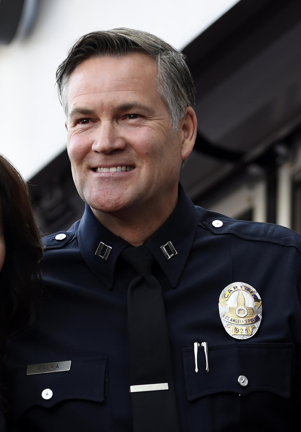 FILE - Former Los Angeles Police Department Captain Cory Palka is pictured during a ceremony to award actor Lynda Carter a star on the Hollywood Walk of Fame, Tuesday, April 3, 2018, in Los Angeles. Palka's ties to Hollywood are under scrutiny after prosecutors say he leaked a sexual assault victim's confidential police report to CBS and its former leader Les Moonves. (AP Photo/Chris Pizzello, File)