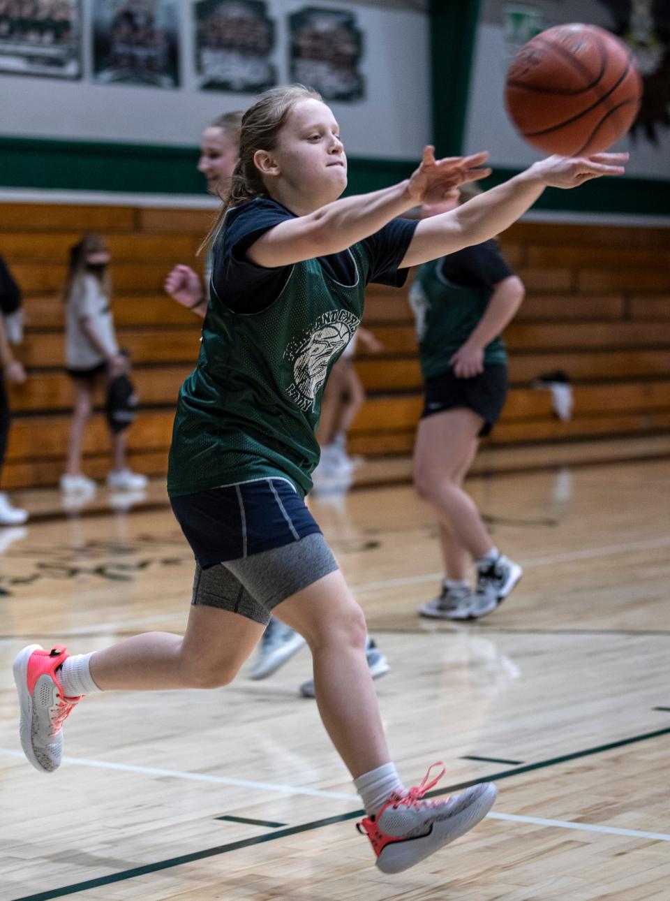 Portland Christian School's girls basketball player Ellie Heid passes the ball during practice. Jan. 19, 2022