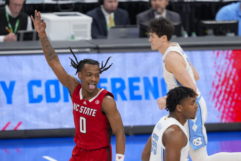 North Carolina State guard DJ Horne (0) celebrating his team scoring against North Carolina during the first half of an NCAA college basketball game in the championship of the Atlantic Coast Conference tournament, Saturday, March 16, 2024 in Washington. (AP Photo/Susan Walsh)