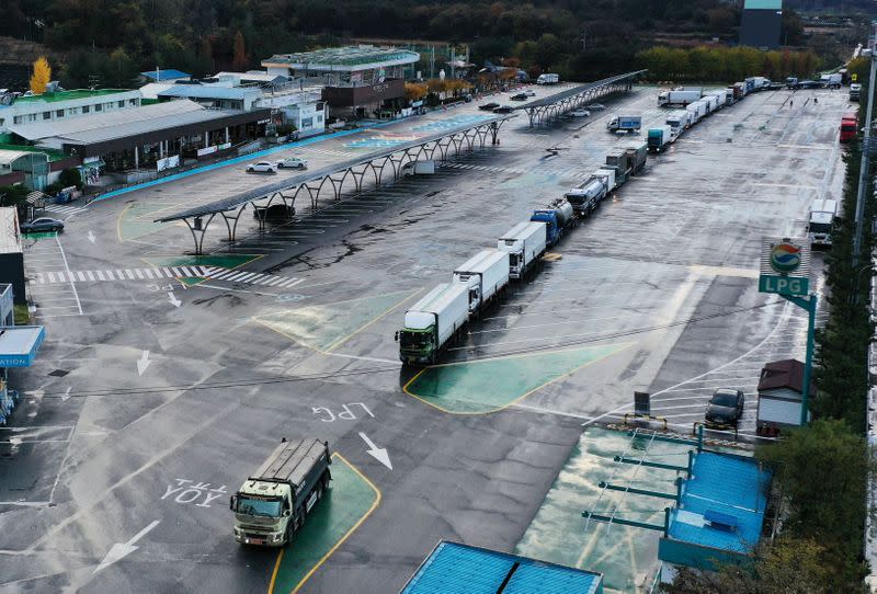 Truck wait in a line to get urea at a service area in Yeoju