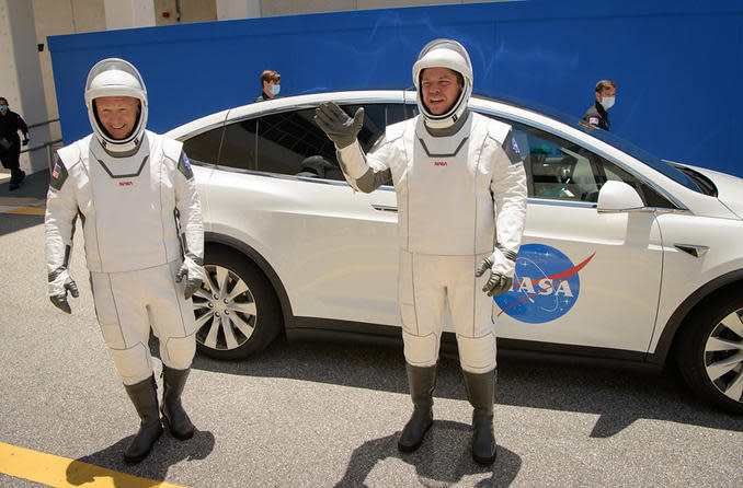 Astronaut Douglas Hurley, left, and Robert Behnken donned pressure suits and headed for launch pad 39A Saturday at the Kennedy Space Center for a dress rehearsal countdown aboard their Crew Dragon spacecraft. Launch is planned for Wednesday at 4:33 p.m. / Credit: NASA