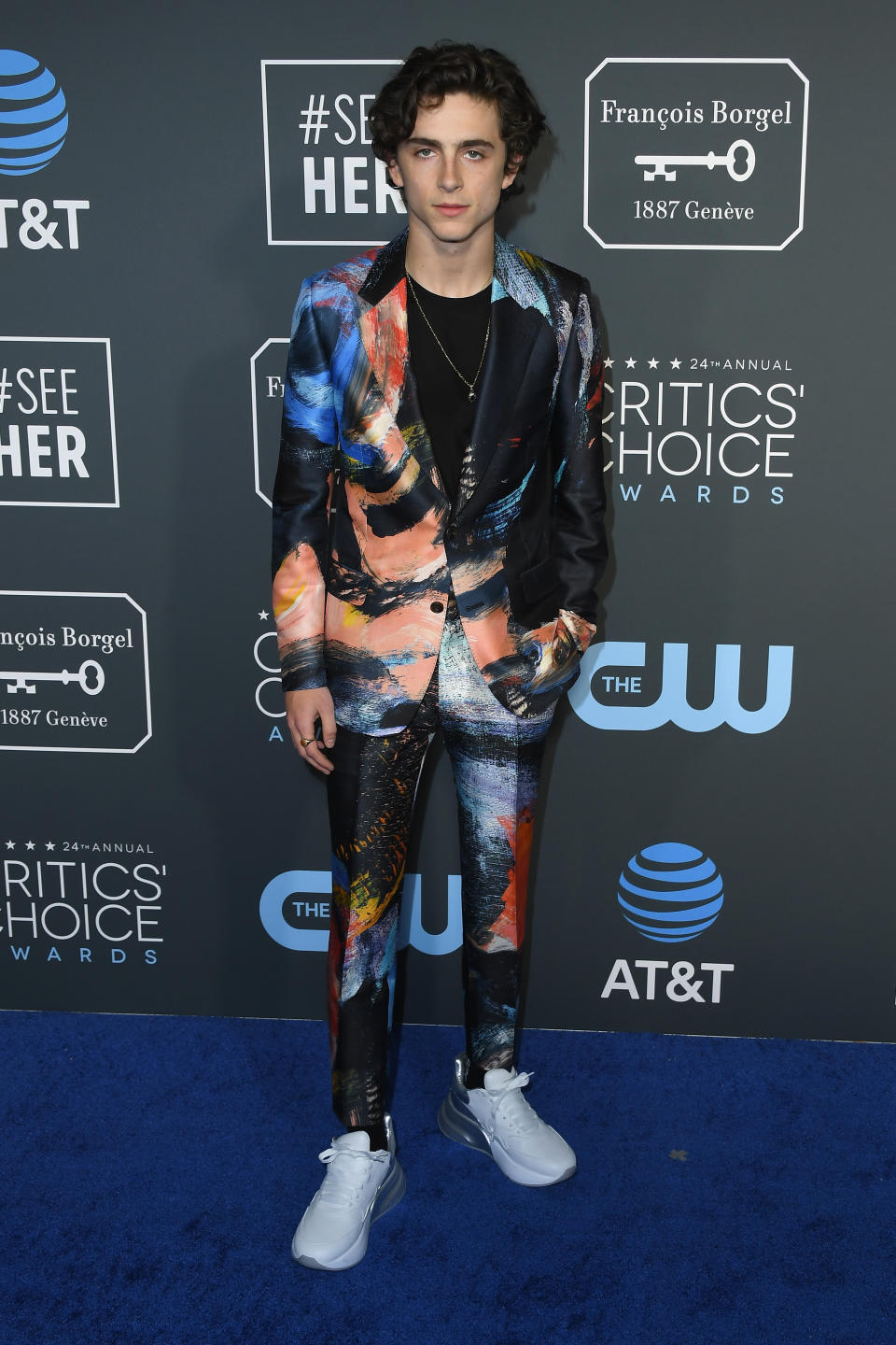 Wearing a multi-coloured Alexander McQueen suit. <em>[Photo: Getty]</em>