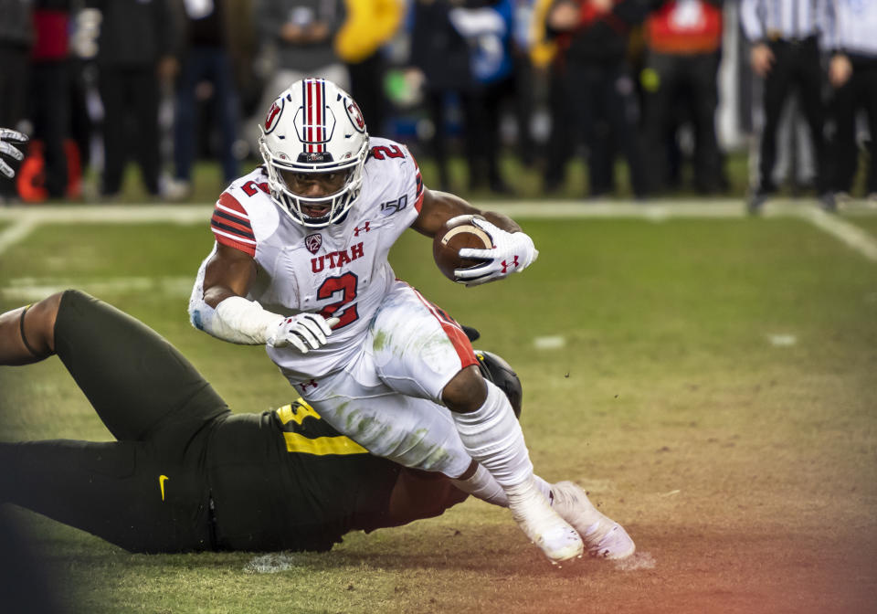 Utah RB Zack Moss has outstanding run skills but also a long injury history. (Photo by Douglas Stringer/Icon Sportswire via Getty Images)