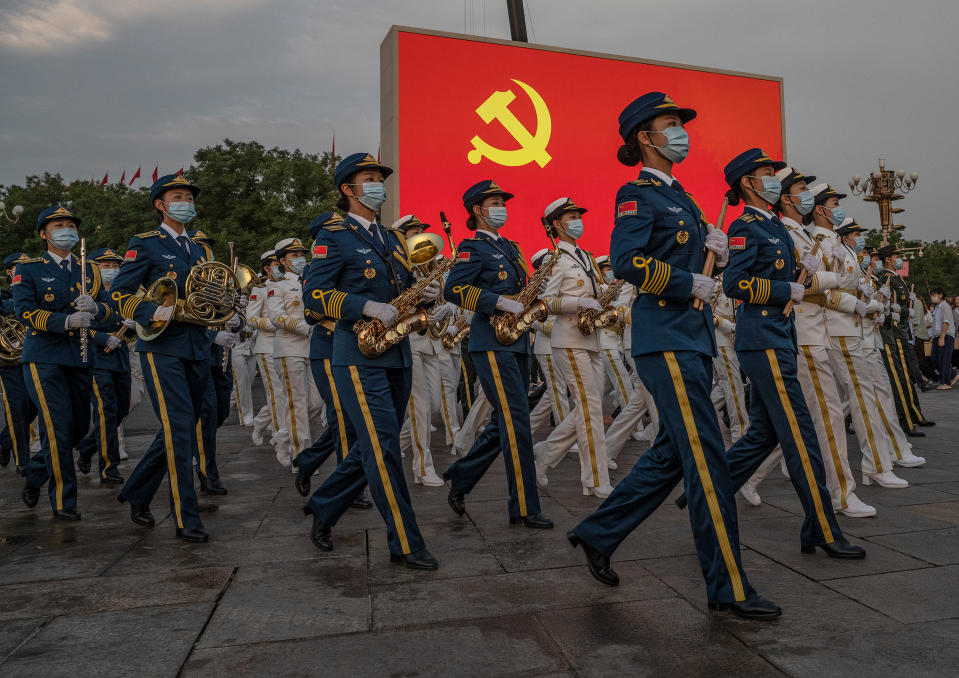 Female members of a People's Liberation Army ceremonial band march at a ceremony marking the 100th anniversary of the Chinese Communist Party in Beijing's Tiananmen Square on July 1.<span class="copyright">Kevin Frayer—Getty Images</span>