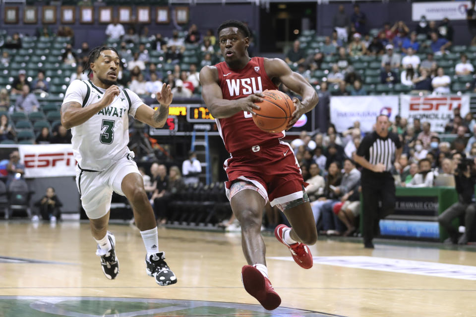 Hawaii guard JoVon McClanahan (3) tries to chase down Washington State guard TJ Bamba during the first half of an NCAA college basketball game Friday, Dec. 23, 2022, in Honolulu. (AP Photo/Marco Garcia)