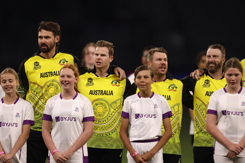 Steve Smith (pictured middle left), David Warner (pictured middle right) and Matthew Wade (pictured right) sing the national anthem.