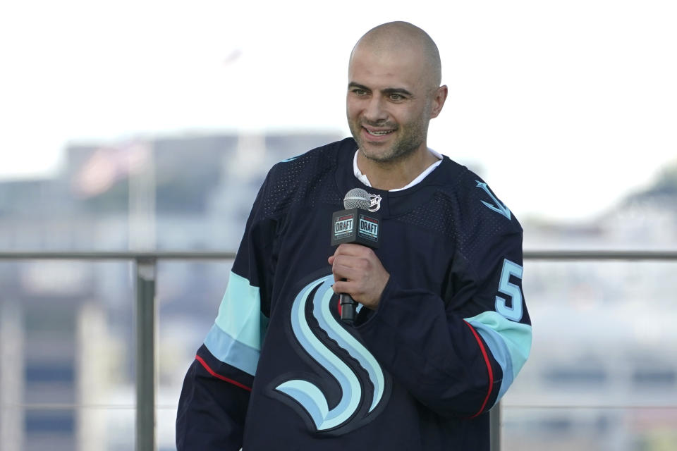 Mark Giordano, a defender from the Calgary Flames, speaks Wednesday, July 21, 2021, after being introduced as a new Seattle Kraken player during the Kraken's NHL hockey expansion draft event in Seattle. (AP Photo/Ted S. Warren)