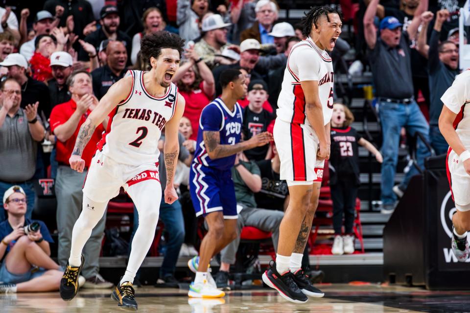 Texas Tech's Pop Isaacs (2) and Texas Tech's Darrion Williams (5) celebrate during the second half against TCU at United Supermarkets Arena on Tuesday, Feb. 20, 2024.