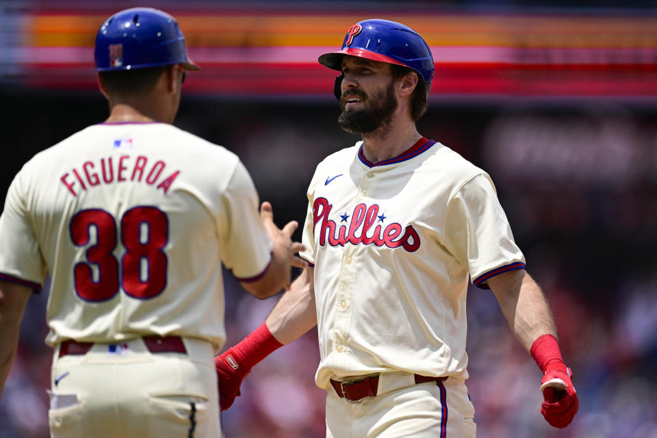 Philadelphia Phillies' David Dahl, right, celebrates after his two-run single during the sixth inning of a baseball game against the Arizona Diamondbacks, Sunday, June 23, 2024, in Philadelphia. (AP Photo/Derik Hamilton)