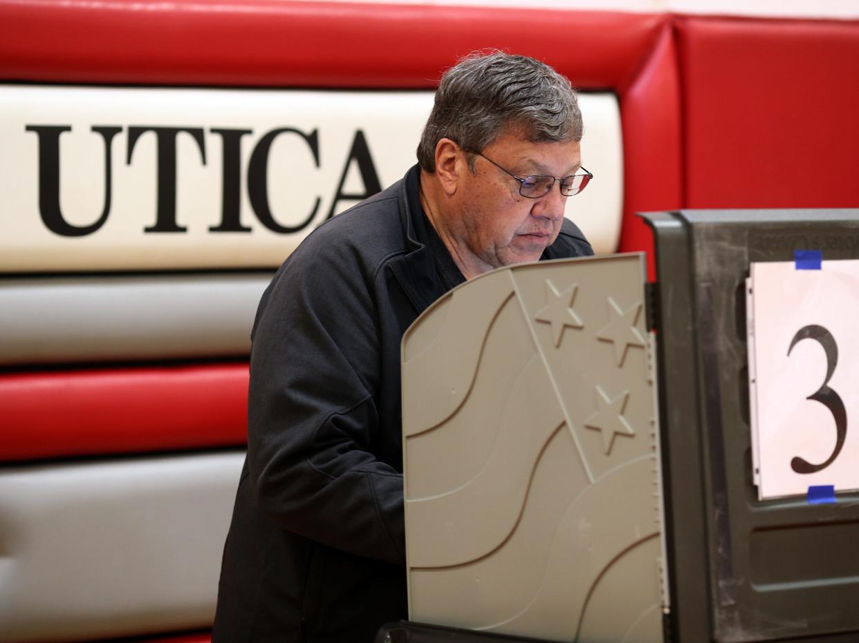 Monte Londot votes at Utica High School on Tuesday, March 19, 2024.