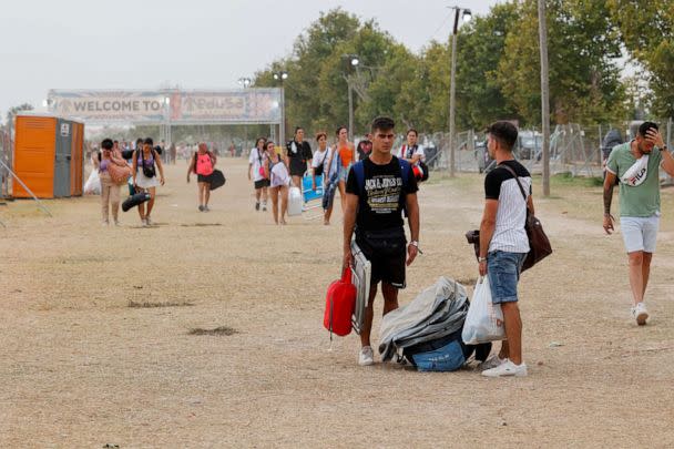 PHOTO: Young people leave the Medusa music festival after high winds caused part of a stage to collapse, in Cullera, near Valencia, Spain, on Aug. 13, 2022. (Eva Manez/Reuters)