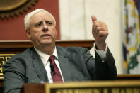 FILE - In this Jan. 9, 2019, file photo West Virginia Gov. Jim Justice delivers his State of the State address in the House of Delegates' Chamber in Charleston, W.Va. A family business of West Virginia’s billionaire governor has maxed out a taxpayer-funded subsidy program meant to help farmers through the U.S. trade war with China. Records reviewed by The Associated Press show Justice Farms of North Carolina took in tens of thousands of taxpayer dollars from the program earlier this year. (Chris Dorst/Charleston Gazette-Mail via AP, File)