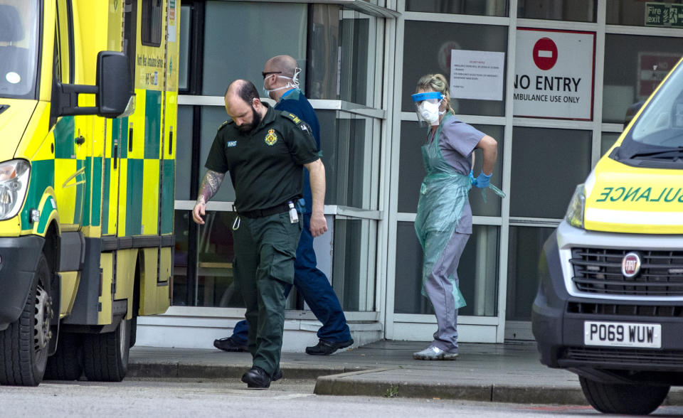 Hospital staff and ambulance staff prepare to take a patient into the Royal Liverpool University Hospital, as Prime Minister Boris Johnson has said the Government is ready to impose tougher restrictions to curb the spread of the coronavirus if people do not follow the guidance on social distancing.