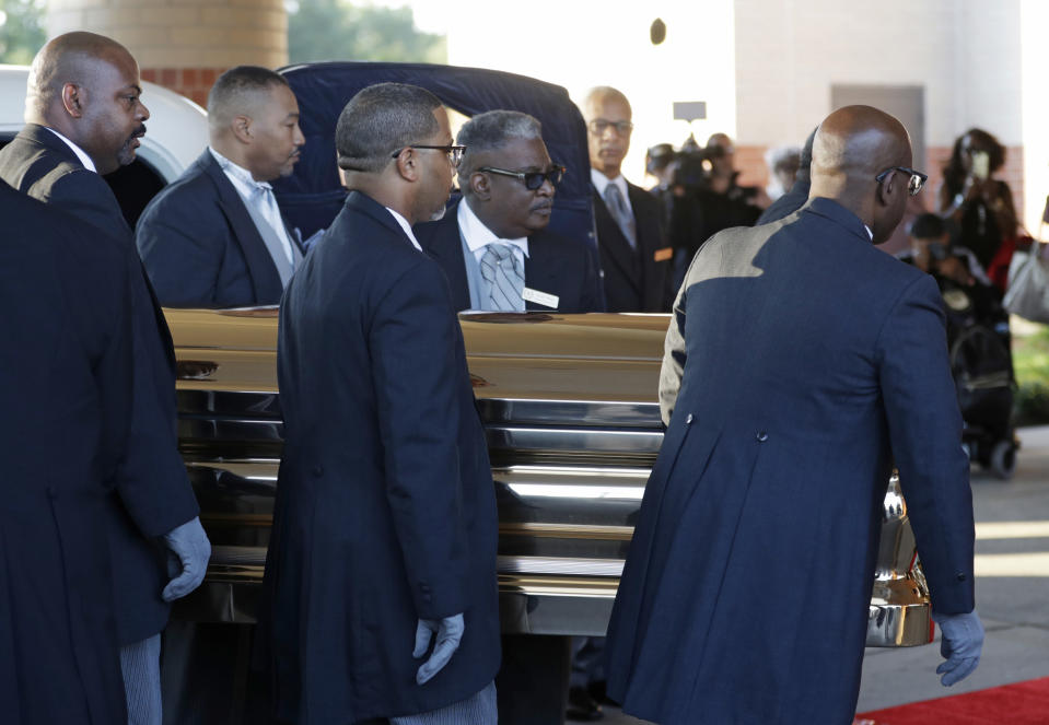 Pallbearers carry the gold casket of legendary singer Aretha Franklin after arriving at the Greater Grace Temple in Detroit, Friday, Aug. 31, 2018. Franklin died Aug. 16 of pancreatic cancer at the age of 76. (AP Photo/Tony Dejak)
