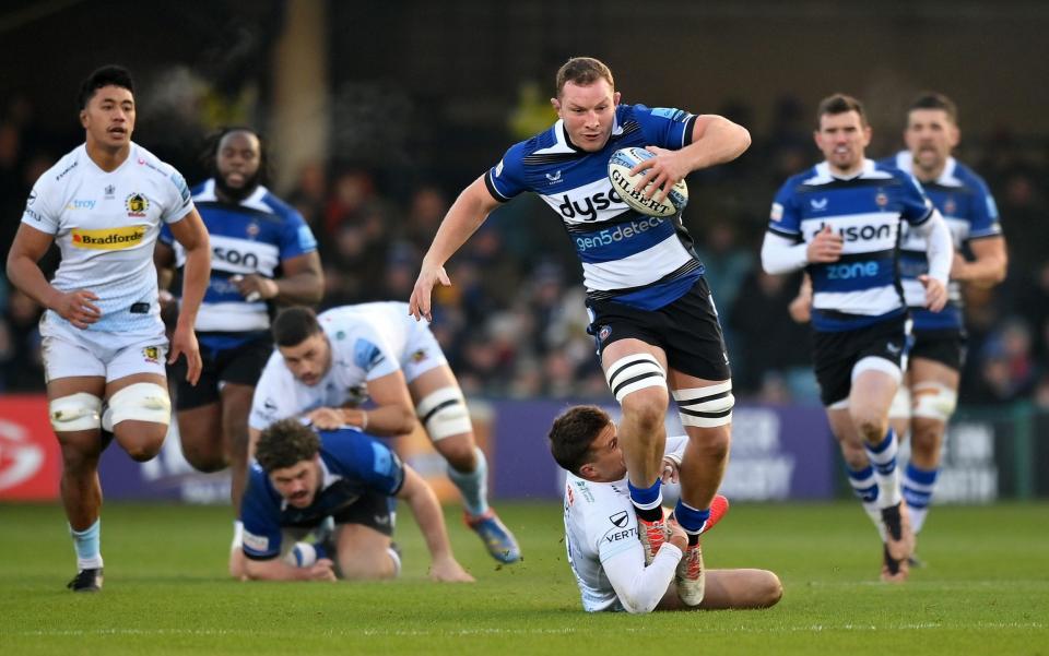 Sam Underhill is tackled by Henry Slade