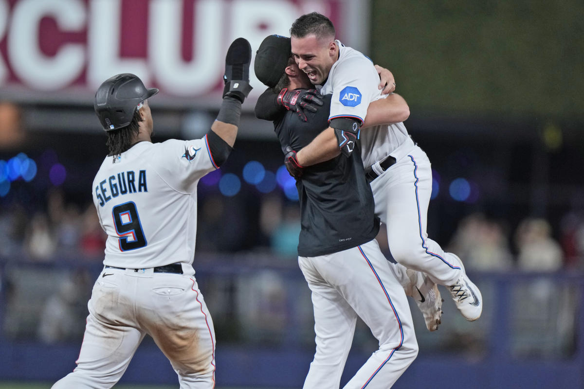 Trevor Rogers of the Miami Marlins celebrates with teammates in