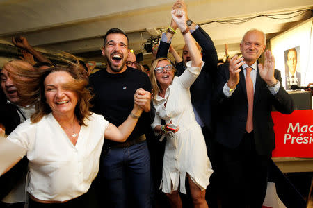 Supporters of French President-elect Emmanuel Macron, head of the political movement En Marche !, or Onwards !, react after announcement in the second round of 2017 French presidential election at En Marche local headquarters in Marseille, France, May 7, 2017. REUTERS/Philippe Laurenson