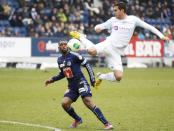 FC Luzern's Otele Mounangue (L) challenges FC Zurich's (FCZ) Mario Gavranovic during their Swiss Super League soccer match in Lucerne, February 17, 2013. REUTERS/Michael Buholzer (SWITZERLAND - Tags: SPORT SOCCER) - RTR3DWSA