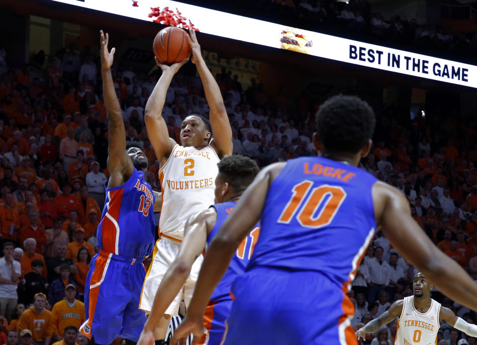 Tennessee forward Grant Williams (2) shoots as he's defended by Florida center Kevarrius Hayes (13) during the second half of an NCAA college basketball game Saturday, Feb. 9, 2019, in Knoxville, Tenn. Tennessee won 73-61. (AP photo/Wade Payne)
