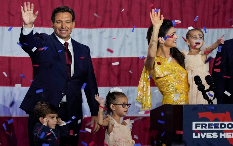 Incumbent Florida Republican Gov. Ron DeSantis, his wife Casey and their children on stage after speaking to supporters at an election night party after winning his race - AP Photo/Rebecca Blackwell