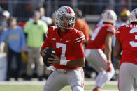 Ohio State quarterback C.J. Stroud drops back to pass against Michigan during the first half of an NCAA college football game against Michigan on Saturday, Nov. 26, 2022, in Columbus, Ohio. (AP Photo/Jay LaPrete)