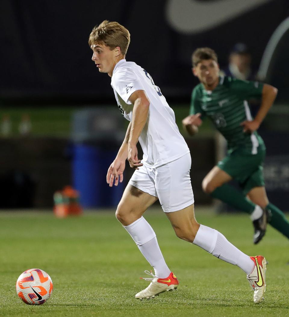 Akron forward Jason Shokalook (9) takes the ball down the field against Cleveland State on Oct. 25, 2022, in Akron.
