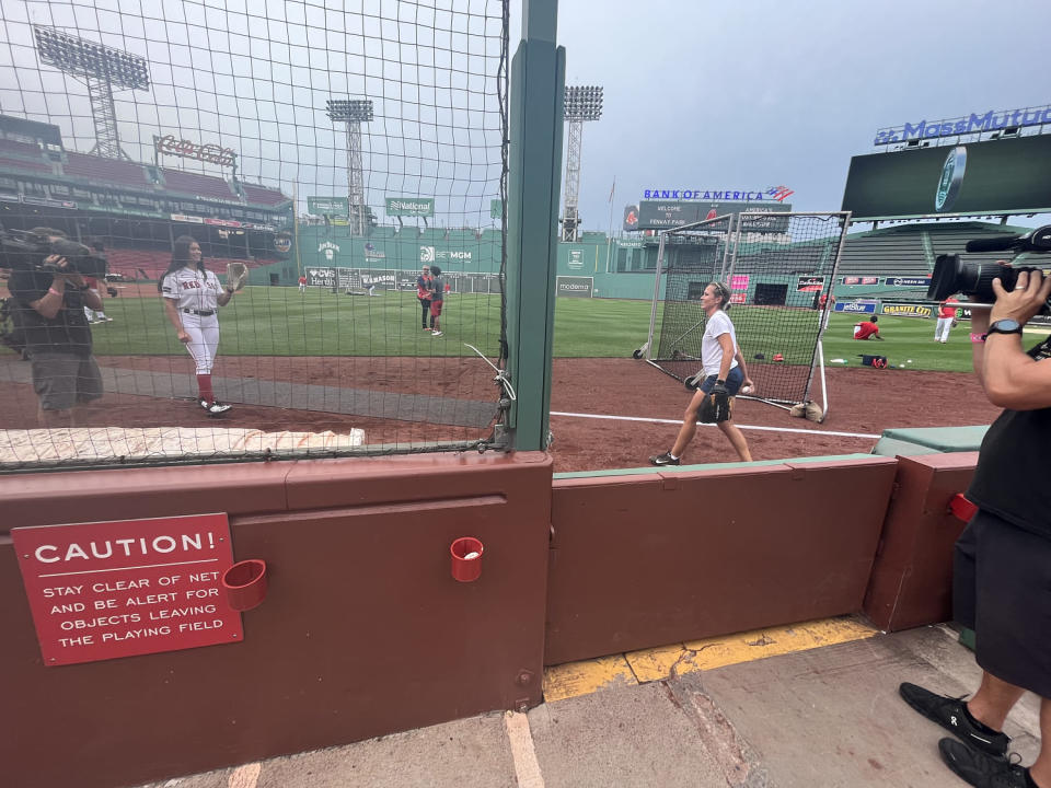 Dylan Dreyer warms up for her gig as a ball attendant, who's responsible for fetching stray baseballs during the game, for the Boston Red Sox. (Erin Kim / TODAY)