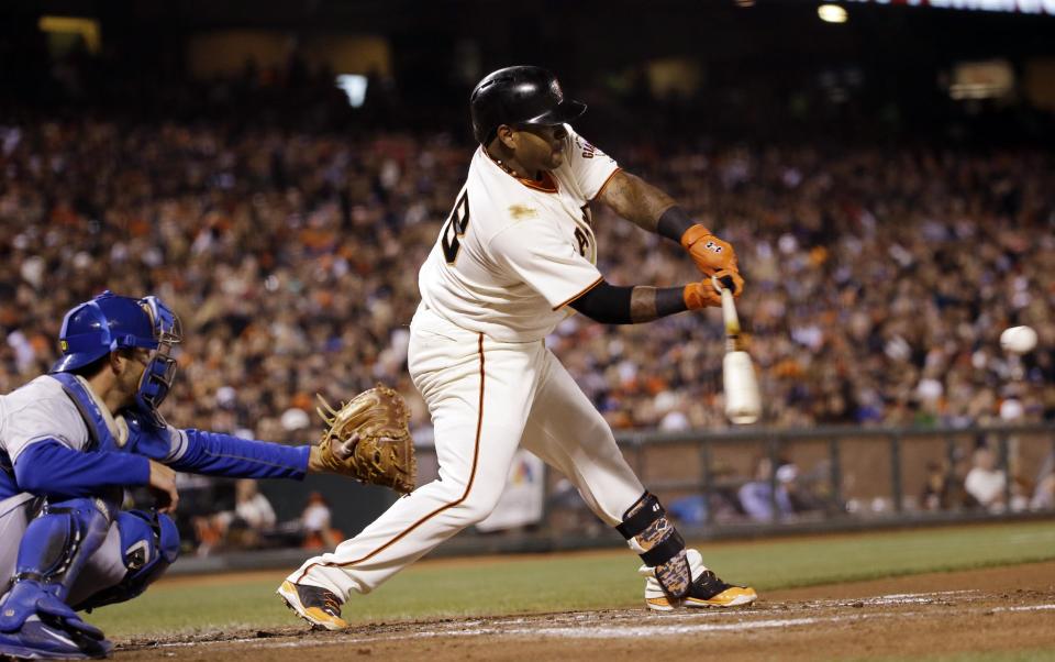 San Francisco Giants' Pablo Sandoval singles against the Los Angeles Dodgers during the third inning of a baseball game Wednesday, April 16, 2014, in San Francisco. (AP Photo/Marcio Jose Sanchez)