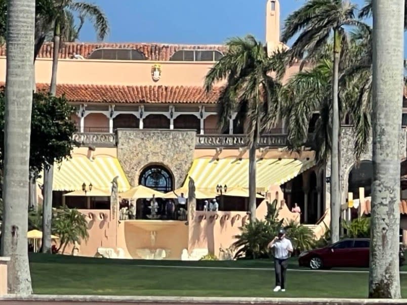 The photo that purportedly shows Trump waving at the boaters from Mar-a-Lago. (Photo: Judy Baldasaro’s Facebook)