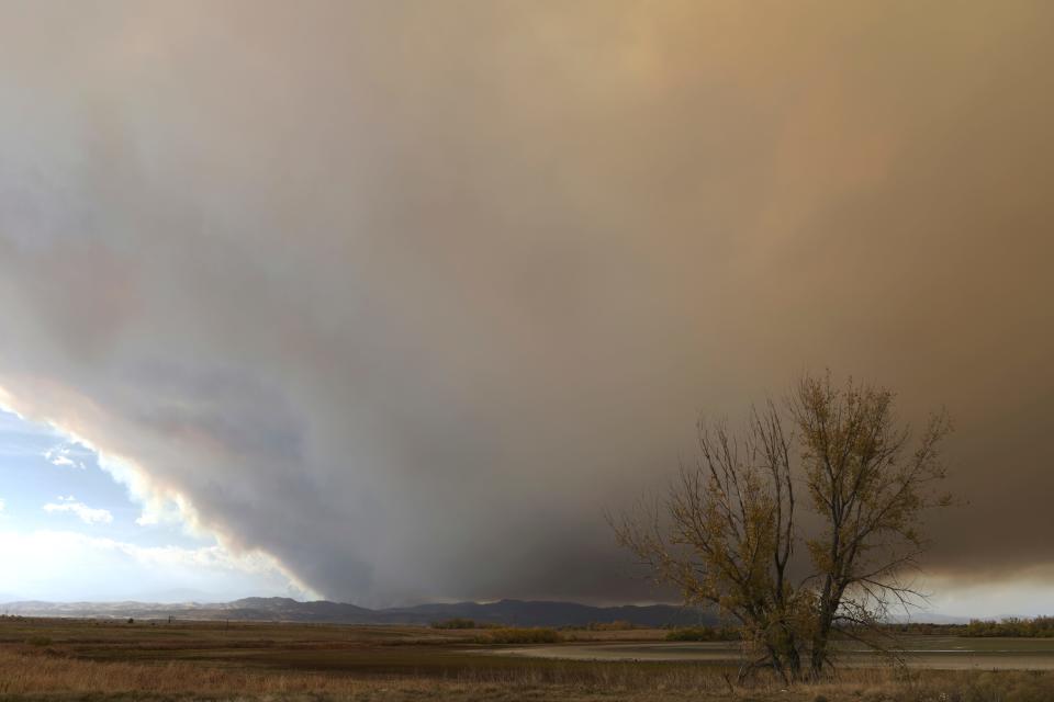 Smoke from the Cameron Peak Fire covers Fort Collins area sky at on Wednesday, Oct. 14, 2020. One of two Rocky Mountain wildfires fanned by strong winds has become the largest in Colorado history.