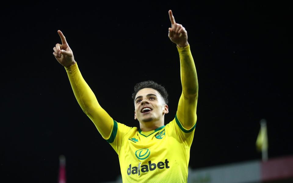  Max Aarons of Norwich City celebrates after Jamal Lewis scores his sides first goal during the Premier League match between Norwich City and Leicester City  -  Julian Finney/Getty Images