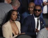 <p>LeBron James waits for a super welterweight boxing match between Floyd Mayweather Jr. and Conor McGregor on Saturday, Aug. 26, 2017, in Las Vegas. Former boxer Mike Tyson sits behind James. (AP Photo/Isaac Brekken) </p>