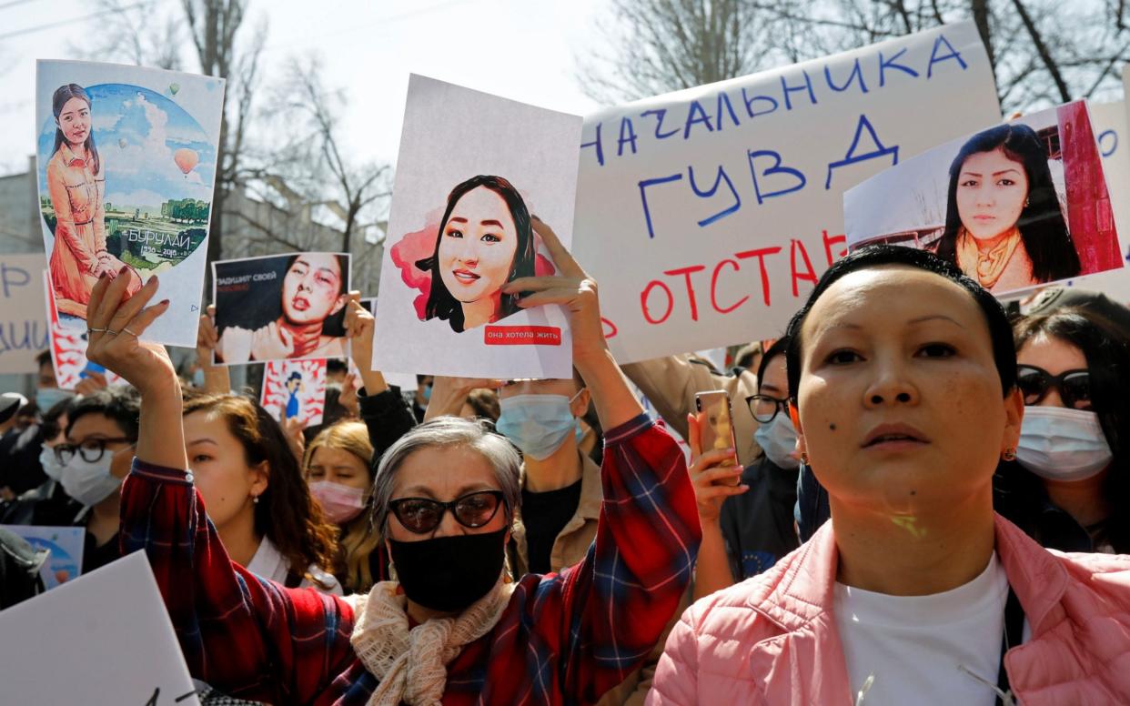 People attend a rally in front of Kyrgyzstan's interior ministry in Bishkek - VLADIMIR 