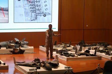 Saudi defence ministry spokesman Colonel Turki Al-Malik displays remains of the missiles which Saudi government says were used to attack an Aramco oil facility, during a news conference in Riyadh