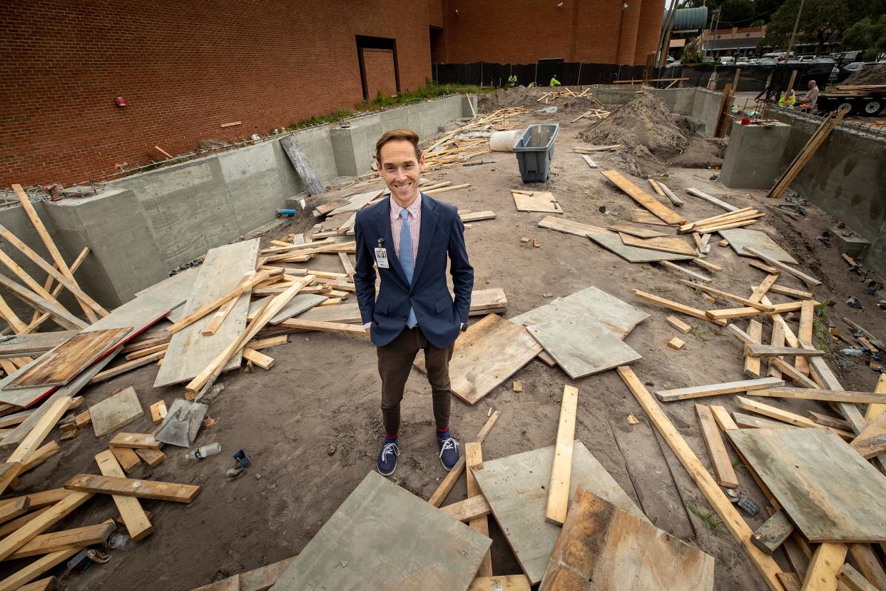 H. Alexander Rich, Executive Director and Chief Curator of the Polk Museum of Art, stands in the construction zone for the expansion of the museum. Construction began in May on the new wing, which will add 14,000 square feet of gallery and other space.