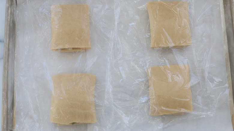 unbaked croissants covered with plastic
