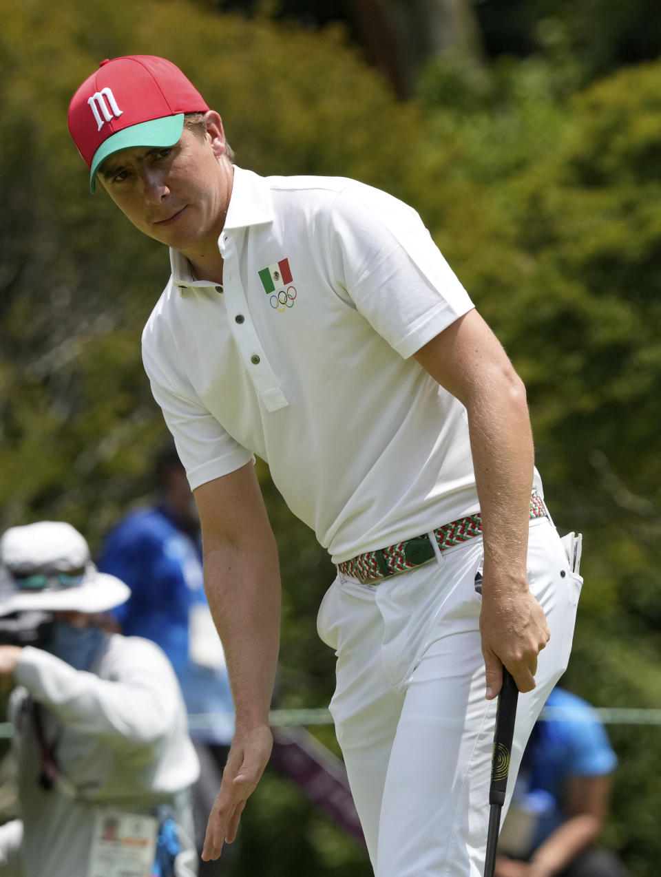 Carlos Ortiz of Mexico reacts after missing a putt on the second hole during the third round of the men's golf event at the 2020 Summer Olympics on Saturday, July 31, 2021, in Kawagoe, Japan. (AP Photo/Andy Wong)