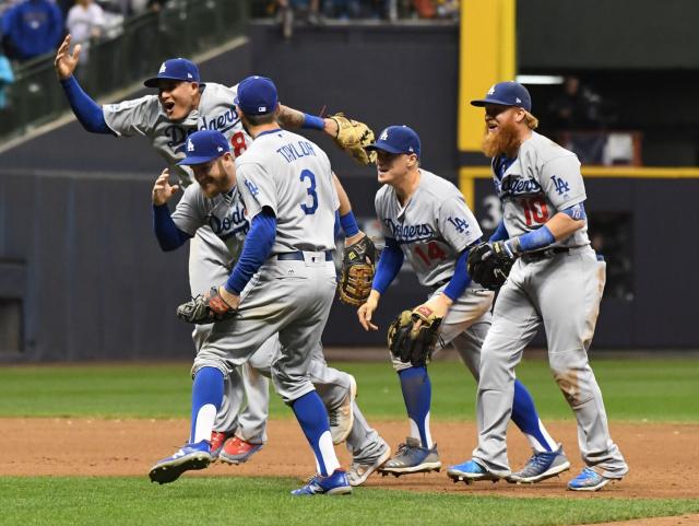 Manny Machado, top left, celebrates with his Dodgers teammates after the team's 2018 National League Championship Series win.
