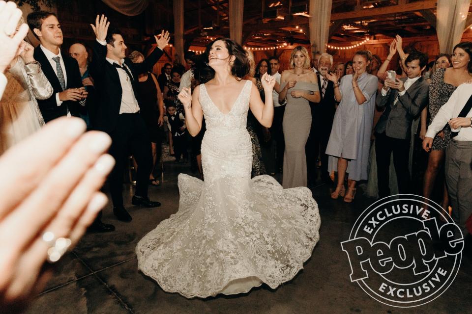 "I want everyone on the dance floor," says Stevens, who changed into a <a href="https://www.galialahav.com/" rel="nofollow noopener" target="_blank" data-ylk="slk:Galia Lahav;elm:context_link;itc:0;sec:content-canvas" class="link ">Galia Lahav</a> dress later in the reception. "My side of the family, we're big dancers. We really get down." Adds DiGiovanni: “Music is important to both of us. It’s what I do for a living, and Katie does a lot of it too, so that was a big thing for the wedding." DiGiovanni’s Boys Like Girls bandmates Martin Johnson and John Keefe were by his side as groomsmen, and the musicians hit the stage to give a special performance at the reception.