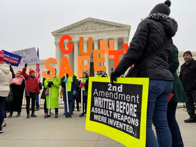 Hundreds of supporters of gun control laws rally in front of the US Supreme Court