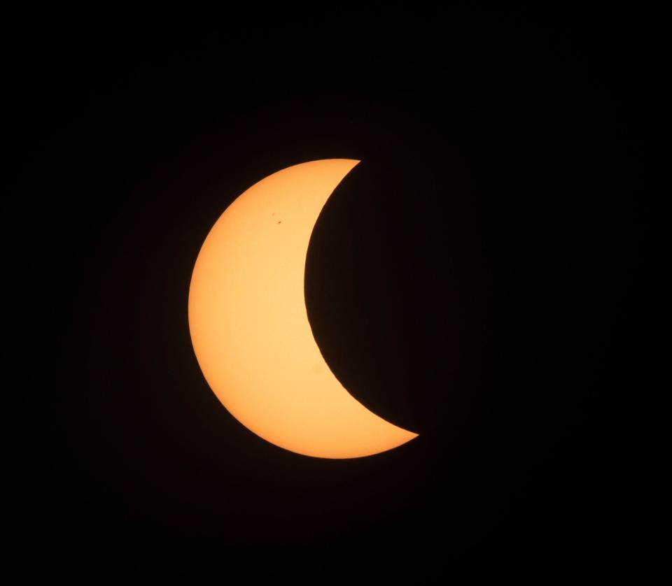 The solar eclipse taken from Fort Myers Beach at the peak at 2:58 p.m. Monday, April 8, 2024. Photographed using a solar filter over the lens.