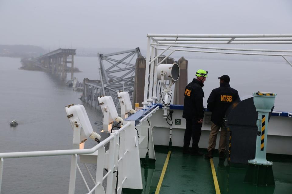 National Transportation Safety Board investigators on the bridge of the cargo vessel Dali, on Tuesday (EPA)